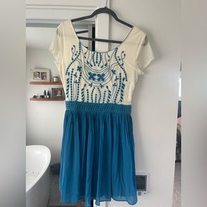 Francesca blue and white embroidered dress with pleats.